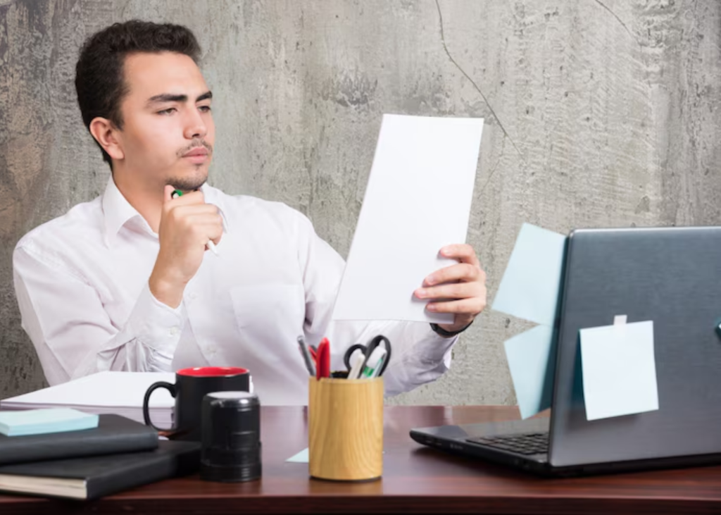 Man checking documentation papers on the table at Dreamway Consultancy